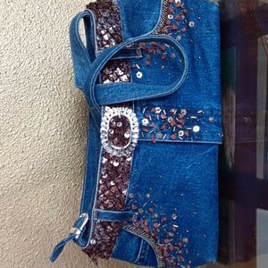 Blue denim , 13.5 X 7" shoulder bag decorated with sequins.